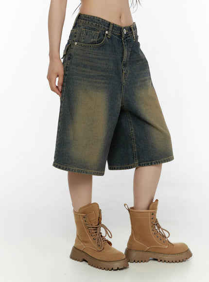 Vintage Washed Jorts CL508 Dark blue side view on model showing wide-leg silhouette, knee-length hem, and faded denim texture with combat boots