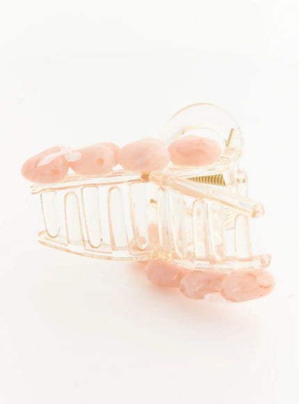 Violet Beige Hair Clip IL503 beige pink side view showing full transparent claw clip silhouette with pink oval resin embellishments along top and bottom edges