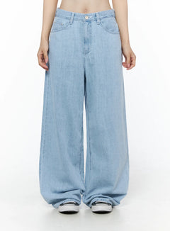 LEWKIN Viori Casual Wide-Leg Jeans IU525 Light blue front crop shot on model size S showing low-rise waistband, button closure, and ultra-wide denim leg hem pooling over sneakers