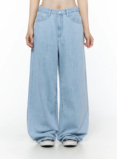 LEWKIN Viori Casual Wide-Leg Jeans IU525 Light blue front crop shot on model size S showing low-rise waistband, button closure, and ultra-wide denim leg hem pooling over sneakers