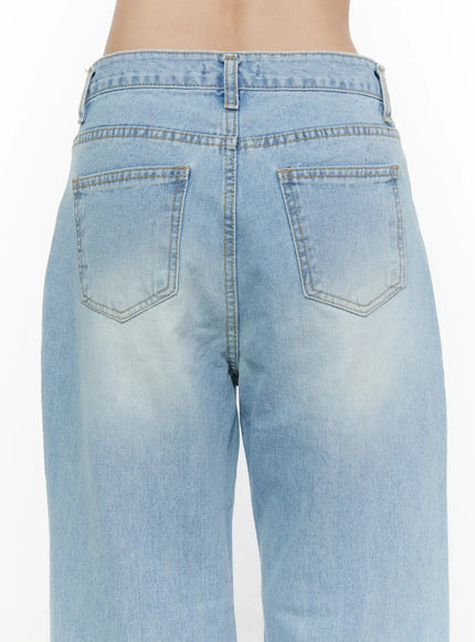 Wade Light Washed Wide Leg Jeans CL520 Light blue close-up back detail shot on model showing dual back pockets center seam waistband stitching and faded denim wash