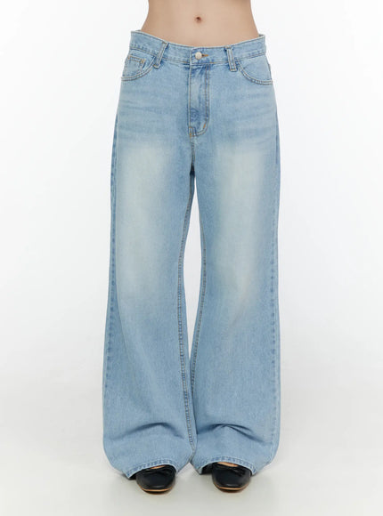 Wade Light Washed Wide Leg Jeans CL520 Light blue front shot on model showing relaxed wide leg silhouette low-rise fit button closure and sun-faded wash denim texture