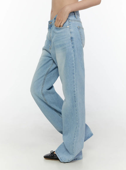 Wade Light Washed Wide Leg Jeans CL520 Light blue side shot on model hand in pocket showing wide leg silhouette low rise rise and full length inseam