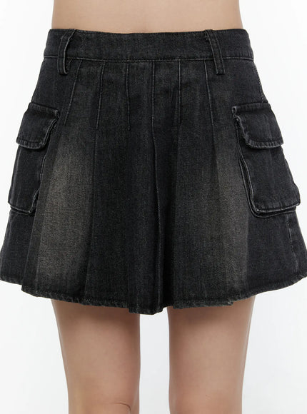Washed Denim Mini Skirt CL508 Black close-up front detail shot on model showing pleated skirt cargo pockets and washed denim texture