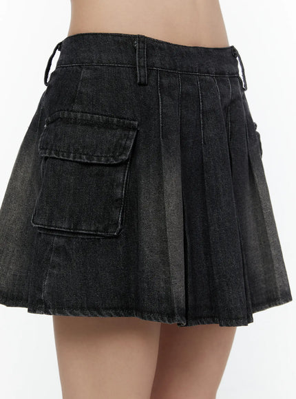 Washed Denim Mini Skirt CL508 Black close-up side detail shot on model showing cargo pocket pleats faded wash and raw hem fringe edge