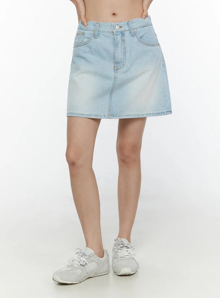 LEWKIN Washed Denim Skirt CL521 Light blue front model shot cropped waist-down view A-line mini silhouette with faded wash and contrast stitching paired with white sneakers