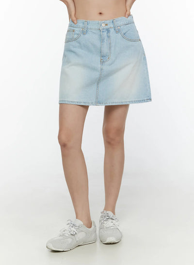 LEWKIN Washed Denim Skirt CL521 Light blue front model shot cropped waist-down view A-line mini silhouette with faded wash and contrast stitching paired with white sneakers