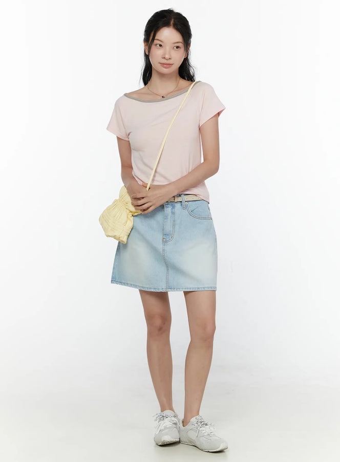 Washed Denim Skirt CL521 Light blue full-body front model shot styled with pink tee belt and yellow crossbody bag standing upright on white background