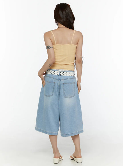 Washed Wide Leg Jorts CL508 Blue back view on model styled with yellow cami top and white star-studded belt, showing back patch pockets and wide-leg hem detail