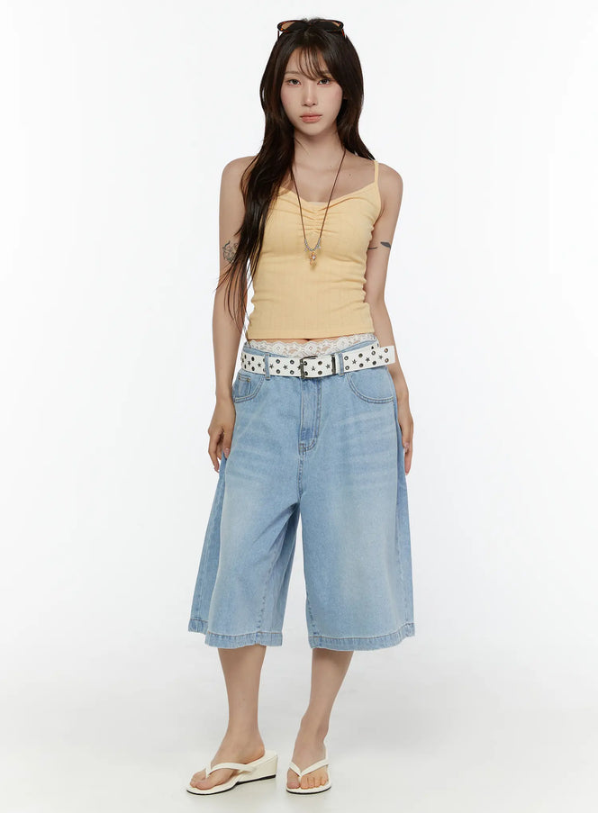 Washed Wide Leg Jorts CL508 Blue full-body front view on model styled with yellow cami top, star-studded white belt, lace waistband detail, and white wedge flip-flops