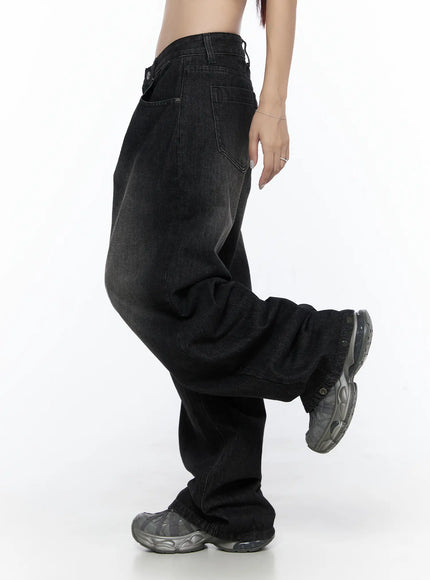 West Wide Leg Jeans CL527 Black side shot on model with leg raised showing oversized wide leg fit, back pocket detail, and faded denim texture
