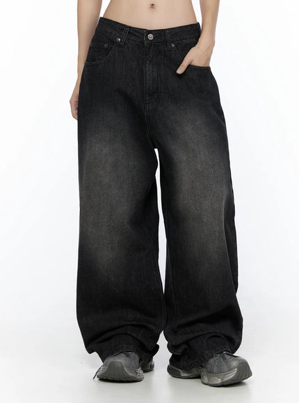 West Wide Leg Jeans CL527 Black front close-up on model showing washed denim texture, mid-rise waistband, button closure, and wide leg silhouette