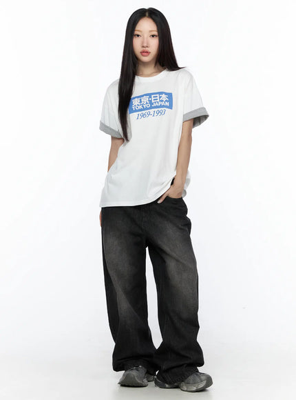 West Wide Leg Jeans CL527 Black full-body front shot on model standing straight in white graphic tee, arms at sides, wide leg silhouette visible