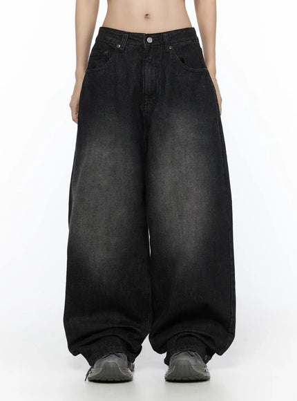 West Wide Leg Jeans CL527 Black front waist-down shot on model showing extreme wide barrel leg silhouette, acid-washed finish, and hem gathered over sneakers