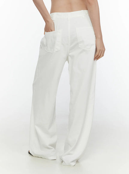 Wide Leg Cotton Pants CL521 White back view on model showing two back patch pockets, adjustable waistband, and wide leg silhouette from hip to hem
