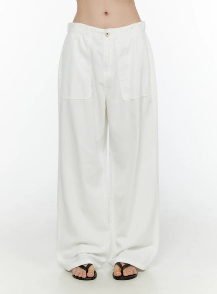 LEWKIN Wide Leg Cotton Pants CL521 White size S front view on model showing low-rise waistband, patch pockets, and relaxed wide leg silhouette with black thong sandals