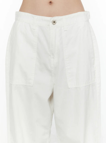 Wide Leg Cotton Pants CL521 White close-up front detail showing low-rise waistband, silver button closure, and large patch pockets on wide cotton fabric
