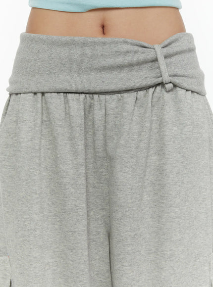 Wide Leg Sweatpants CL508 gray close-up detail of fold-over ribbed waistband with twisted knot accent on model