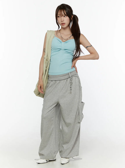 Wide Leg Sweatpants CL508 gray front full-body shot on model with twintails looking sideways silver chain drawstring detail and cargo pockets