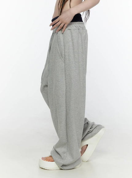Wide Leg Sweatpants IL522 Gray side shot on model showing navy contrast double waistband, drawstring waist, oversized wide-leg fit, white platform sandals