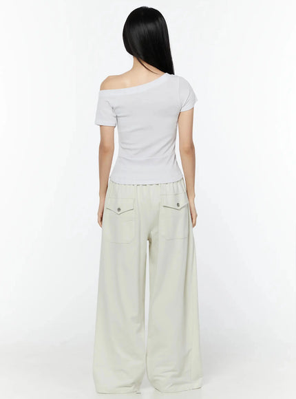 Wide Leg Sweatpants IU524 Light beige back view on model showing two flap patch pockets with silver snap buttons and wide-leg silhouette