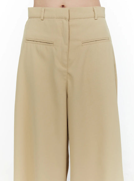 Wide Leg Tailored Pants CL520 Beige close-up back detail on model showing twin welt pockets high waistband belt loops and wide flared leg