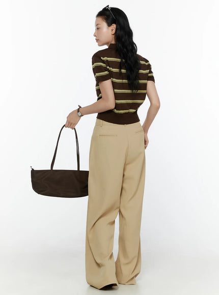Wide Leg Tailored Pants CL520 Beige full-length back view on model holding waistband showing high rise fit rear pockets and floor-grazing wide leg hem