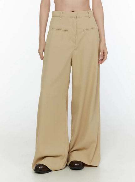 LEWKIN Wide Leg Tailored Pants CL520 Beige front view on model cropped at waist showing high waist belt loops and wide leg silhouette with dark loafers