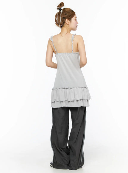 Wide Leg Track Pants CL501 Dark gray back full-body styling shot on model, gray tiered ruffle cami top, reflective side stripe nylon pants