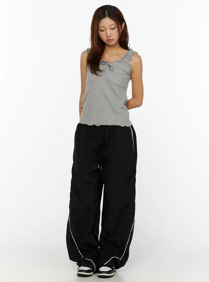 Wide-Leg Track Pants CL515 Black front full-body shot on second model with gray polka dot tank top standing relaxed showing full pant length