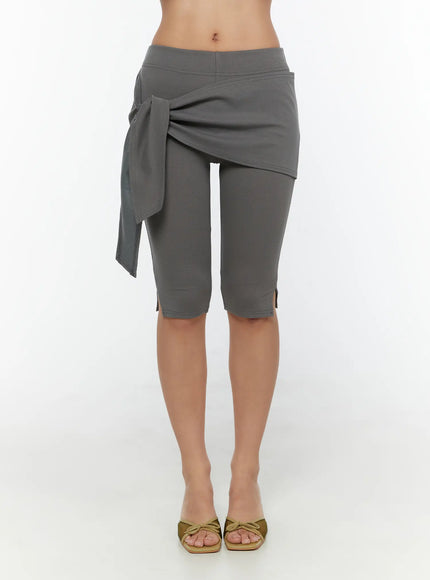 Wrap Capri Pants CU526 Dark gray front shot model displaying wrap skirt overlay with side tie knot low-rise waistband and fitted capri silhouette