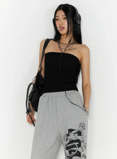 LEWKIN Wrinkle Textured Tube Top IL516 Black S/M front shot on model styled with headphones, crossbody bag, and grey graphic sweatpants