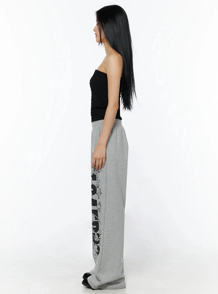 Wrinkle Textured Tube Top IL516 Black side shot on model showing elongated side profile with grey wide-leg sweatpants and straight stance