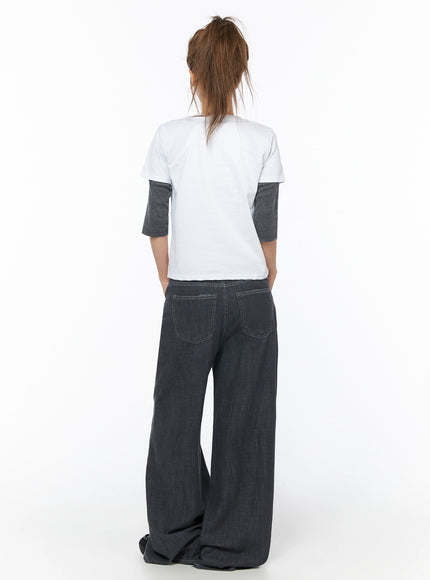 Zena Summer Baggy Jeans IU525 Black back full-body shot on model showing rear patch pockets, wide-leg silhouette, and contrast stitching