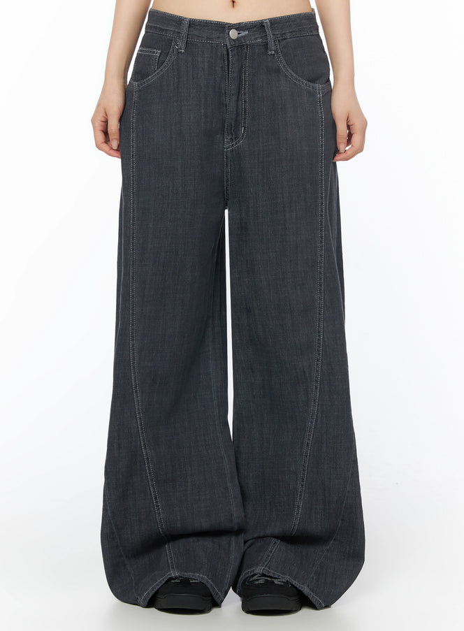 LEWKIN Zena Summer Baggy Jeans IU525 Black front close-up on model showing wide-leg silhouette, contrast white stitching, and button fly detail, size S