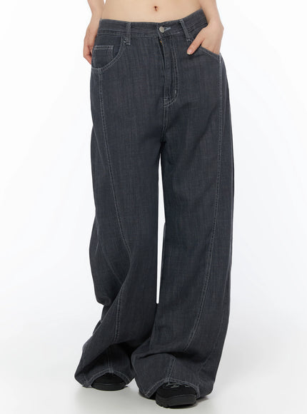 Zena Summer Baggy Jeans IU525 Black front waist-to-hem shot on model with hand in pocket showing wide-leg denim and topstitched seams