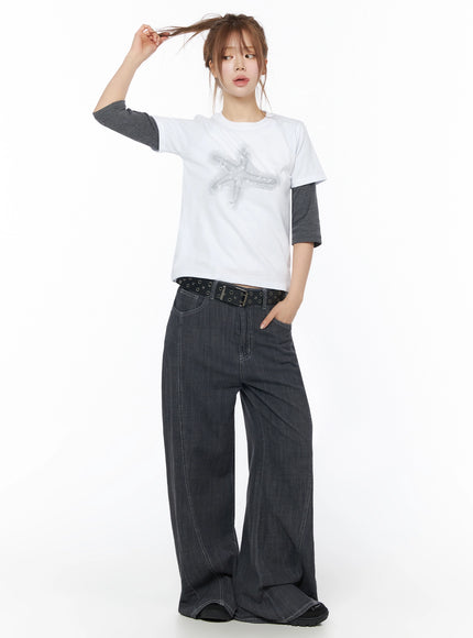 Zena Summer Baggy Jeans IU525 Black full-body front shot on model styled with graphic tee layered over grey long-sleeve and black eyelet belt