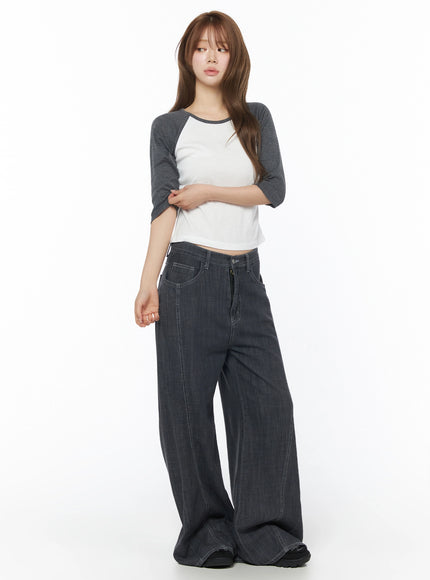 Zena Summer Baggy Jeans IU525 Black full-body side-angled shot on model with long hair, paired with raglan crop top, hands at sides