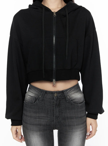 Zip-Up Crop Hoodie CL527 Black close-up front detail shot on model showing double zipper pull drawstring hood and cropped hem