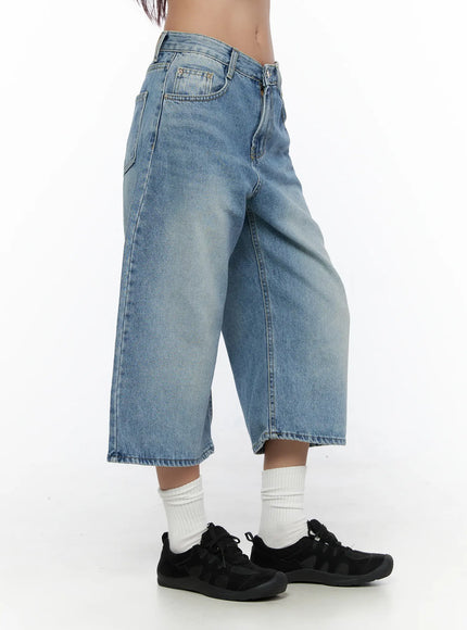 Zivah Low-Rise Baggy Jorts CL513 light blue side shot on model showing wide-leg cropped silhouette low-rise waist and raw hem paired with black sneakers