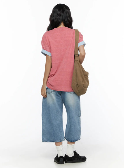 Zivah Low-Rise Baggy Jorts CL513 light blue back full-length shot on model styled with pink tee and tan canvas shoulder bag showing overall silhouette