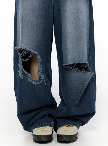 Zovie Distressed Washed Wide Leg Jeans CL514 Dark blue close-up detail shot of both knee rip cutouts with frayed raw edges and faded denim wash