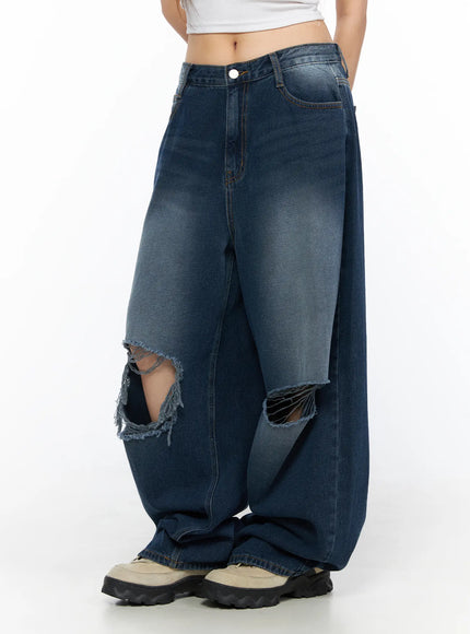 Zovie Distressed Washed Wide Leg Jeans CL514 Dark blue side shot on model highlighting wide-leg silhouette and dual knee rip cutouts with frayed edges