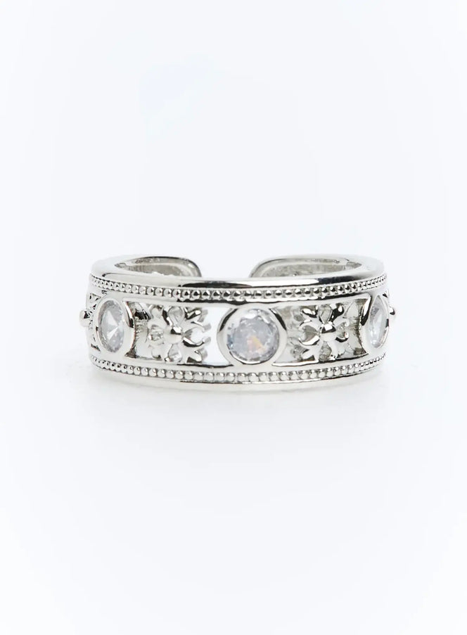 Calder Ring IU503 in silver, front-facing product shot displaying open-back adjustable band, round CZ stones, and intricate filigree between milgrain rails.