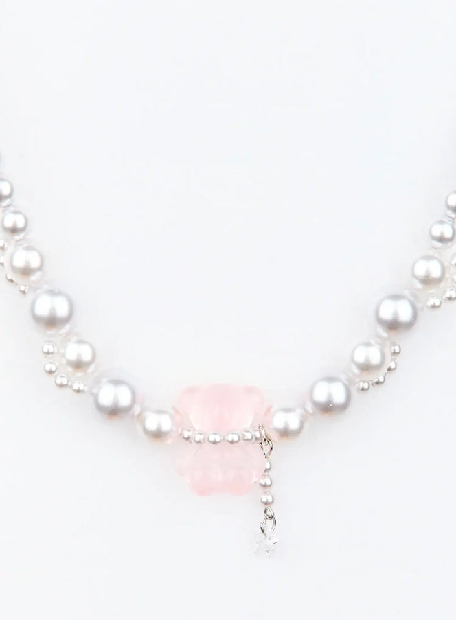 Cato Lovely Necklace IU503 in silver and pink, flat product close-up, mixed-size pearl beads with translucent pink gummy bear focal piece and dangling crystal star charm.