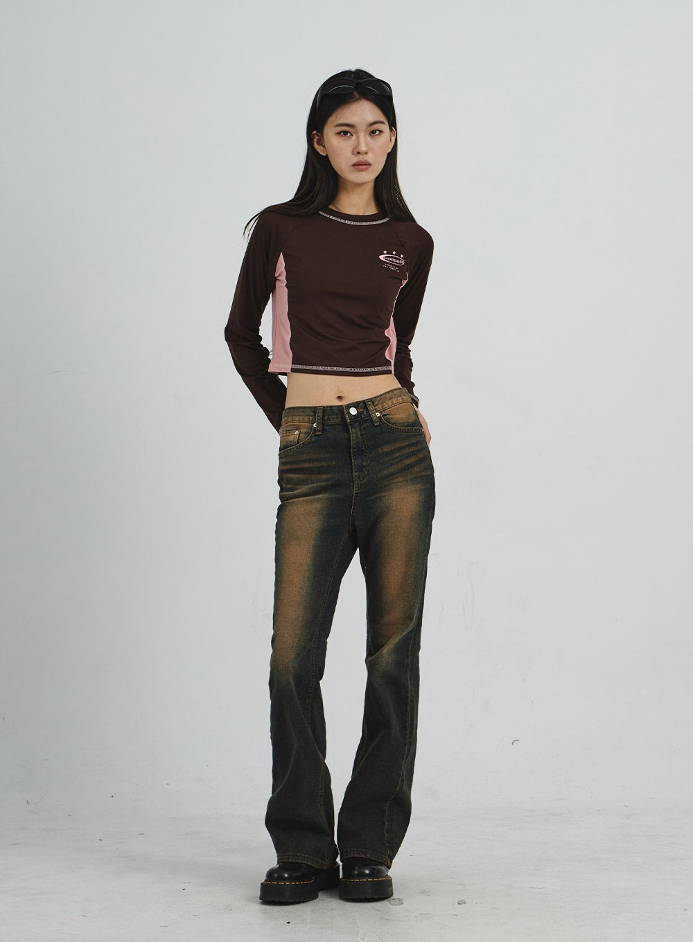 LEWKIN Vintage Washing Bootcut Jeans CD02 in dark washed denim, full-length front view on model, slim-fit bootcut silhouette with amber fade, paired with brown crop top and chunky boots.