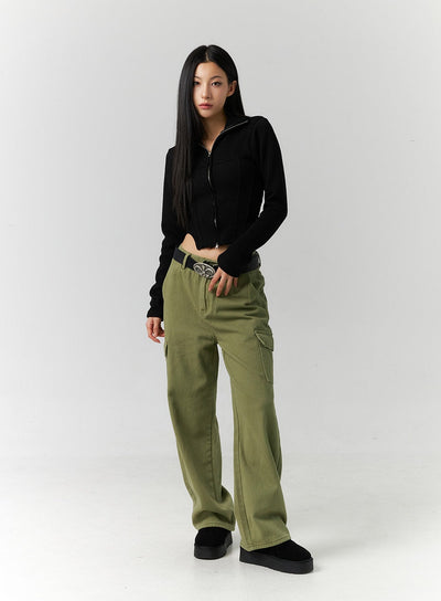 LEWKIN Cargo Straight Leg Pants ID306 in dark green, full-length front view on model, wide-fit cotton cargo pants with side flap pockets, belted, styled with black zip-up crop top and platform shoes.