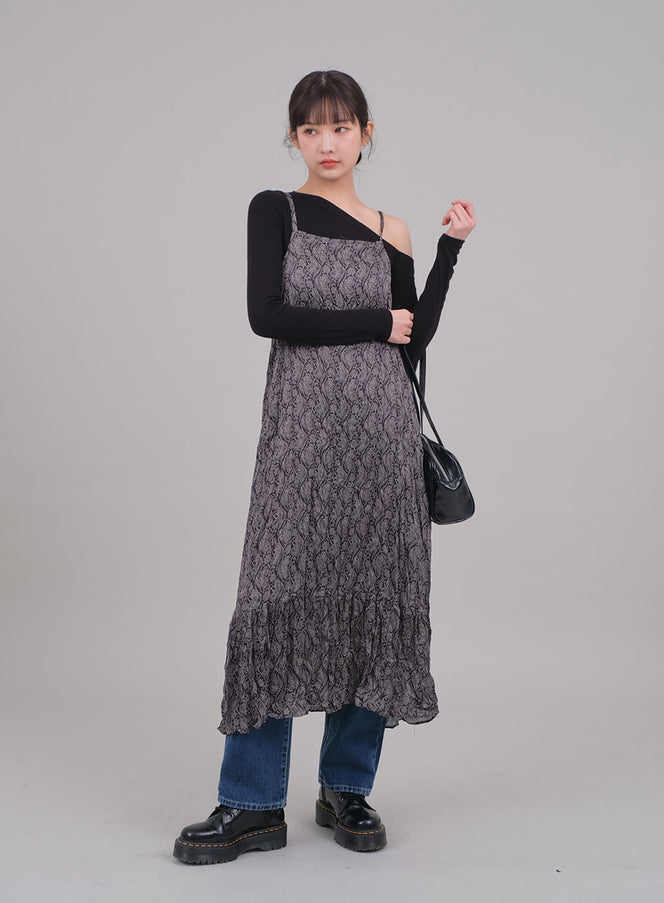 One Shoulder Crop Top C2701 in black, full-body front on model, layered under grey snake-print slip dress with blue jeans, black chunky boots and shoulder bag.