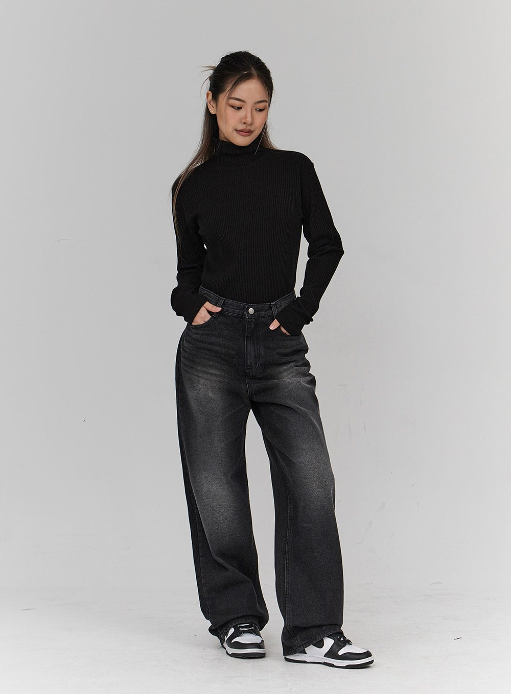 Light Washing Wide Leg Black Jeans CN23 in washed black, full-length front view on model, relaxed wide leg silhouette, styled with black turtleneck and white sneakers.