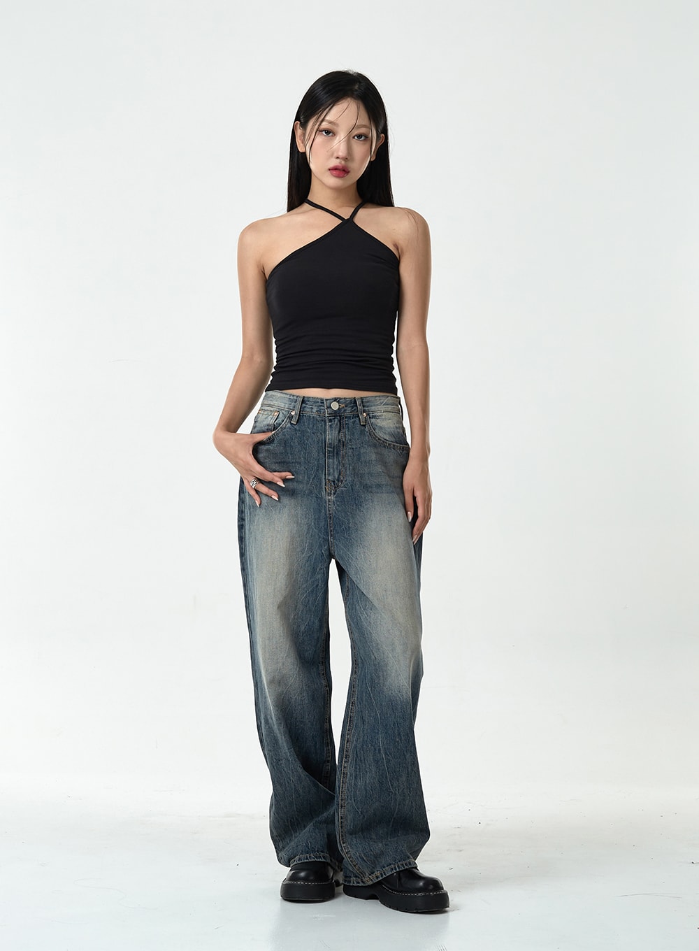 LEWKIN Washed Denim Pants CG10 in dark blue, full front view on model size 1XL, wide-leg cotton denim with washed fading, paired with black halter crop top and chunky loafers.